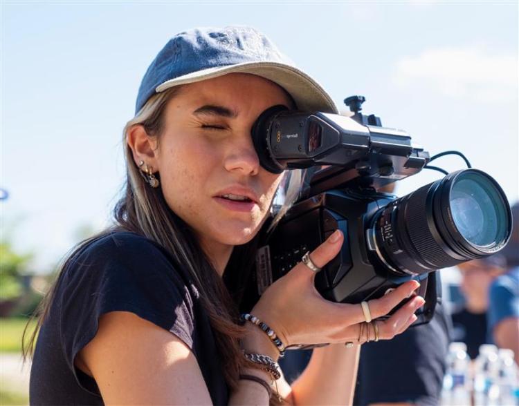 Student looking through camera 