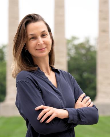 Sarah Arrigada standing in front of the Mizzou Columns