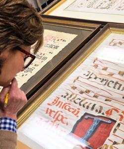 Virginia Blanton examining an ancient manuscript